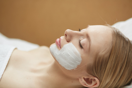 Beautiful young woman in cosmetic salon close upの写真素材