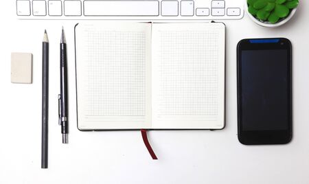 open daily, a computer and a smartphone on the desktop in the office.の写真素材