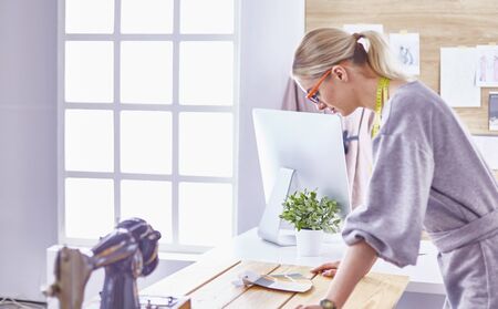 Attractive fashion designer working in officeの写真素材