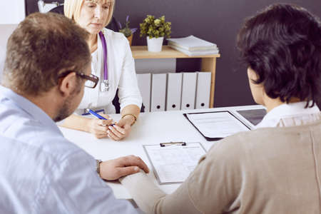Couple at reception discussing issues with a sexologistの写真素材