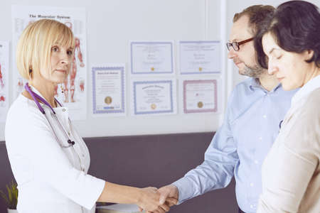 Couple at reception discussing issues with a sexologistの写真素材
