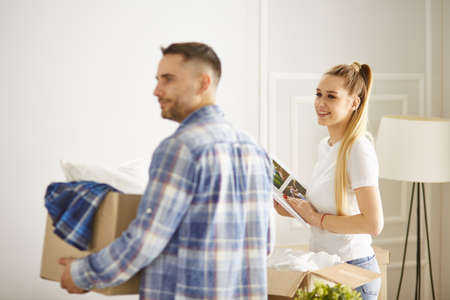 happy Young couple moving in new homeの写真素材