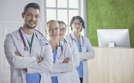 Smiling team of doctors and nurses at hospitalの写真素材