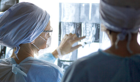 Two female women medical doctors looking at x-rays in a hospital