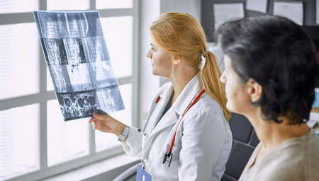 young woman doctor takes patient in officeの写真素材