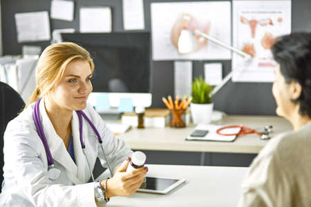 young woman doctor takes patient in officeの写真素材