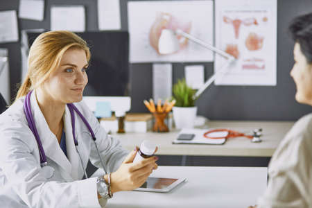 young woman doctor takes patient in officeの写真素材