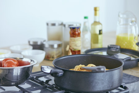 Composition with wooden board and ingredients for cooking on tableの写真素材