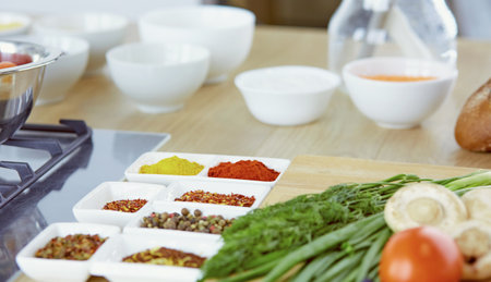 Composition with wooden board and ingredients for cooking on tableの写真素材