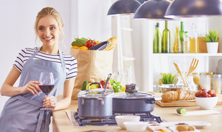 Young Woman Cooking in the kitchen. Healthy Foodの写真素材