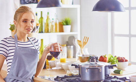Young Woman Cooking in the kitchen. Healthy Foodの写真素材