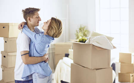 Doctor with laptop and pregnant woman in doctors officeの写真素材