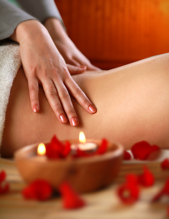 Beautiful young woman getting spa massageの写真素材
