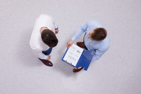 Overhead view of people having business meeting, isolated on white backgroundの写真素材