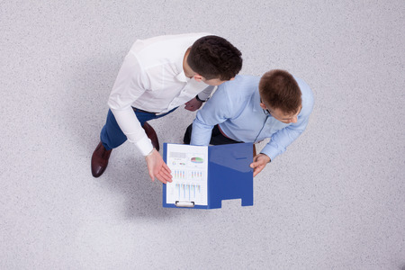 Overhead view of people having business meeting, isolated on white backgroundの写真素材