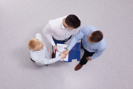 Overhead view of people having business meeting, isolated on white backgroundの写真素材