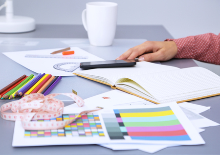 Modern young fashion designer working at studio.の写真素材