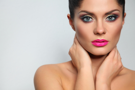 Portrait of beautiful woman, isolated on grey backgroundの写真素材