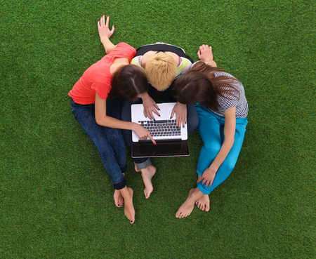 Group of young student using laptop togetherの写真素材
