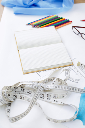 Designers table with blank note and tools ,glassesの写真素材