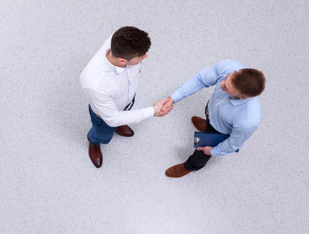 Business people handshake, sitting in the officeの写真素材