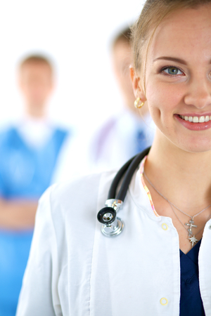 Woman doctor standing with stethoscope at hospitalの写真素材