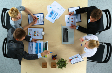 Business people sitting and discussing at business meeting, in officeの写真素材