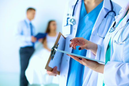 Young woman  doctor holding a tablet pcの写真素材
