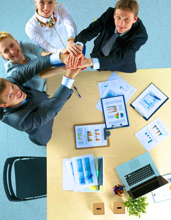 Business team with hands together - teamwork concepts