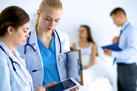 Young woman  doctor holding a tablet pcの写真素材