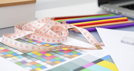 Designer&amp;#39;s table with blank note and tools .の写真素材