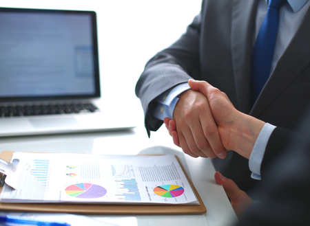 Business handshake. Business people shaking hands, finishing up a meetingの写真素材