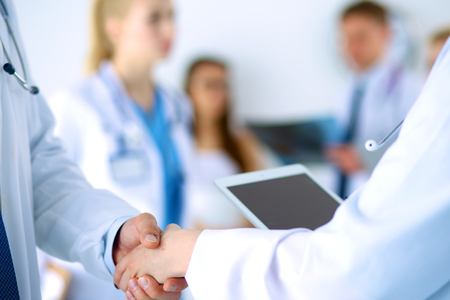 Young medical people handshaking at office .の写真素材