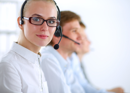 Attractive positive young businesspeople and colleagues in a call center office.の写真素材