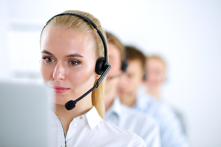 Attractive positive young businesspeople and colleagues in a call center office.の写真素材