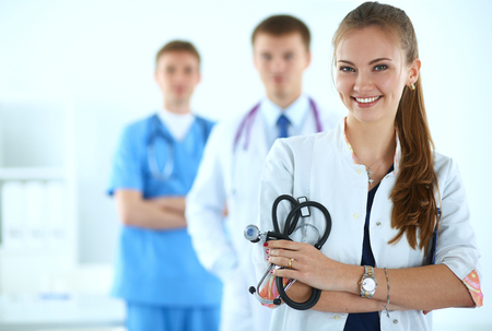 Attractive female doctor in front of medical group .の写真素材