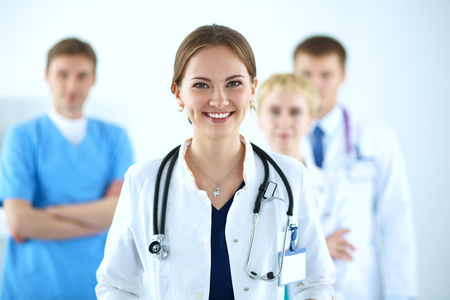 Attractive female doctor in front of medical group .の写真素材