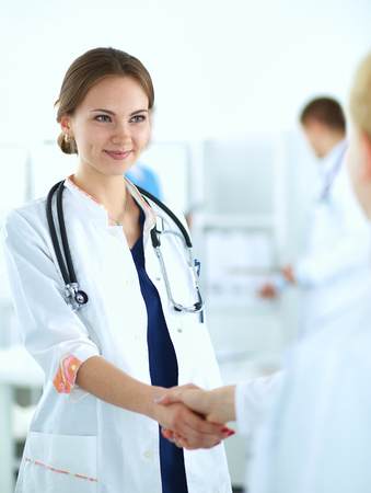 Young medical people handshaking at office .の写真素材