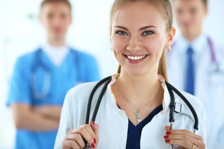 Attractive female doctor in front of medical group .の写真素材
