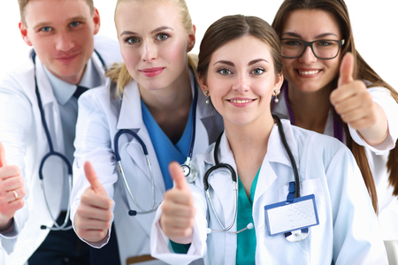 Portrait of doctors team showing thumbs up .の写真素材