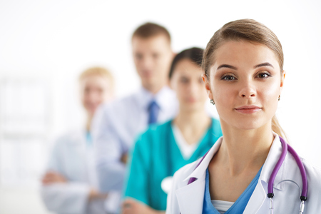 Attractive female doctor in front of medical group .の写真素材