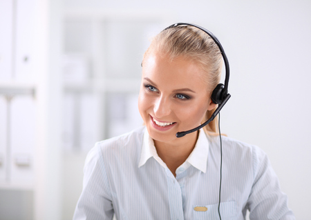 portrait of a customer service agent sitting at officeの写真素材