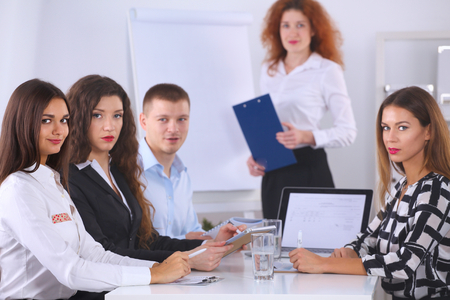 Business people sitting and discussing at business meeting, in office .の写真素材