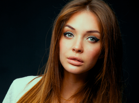 Portrait of a beautiful woman , isolated on black background .の写真素材
