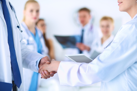 Young medical people handshaking at office .の写真素材