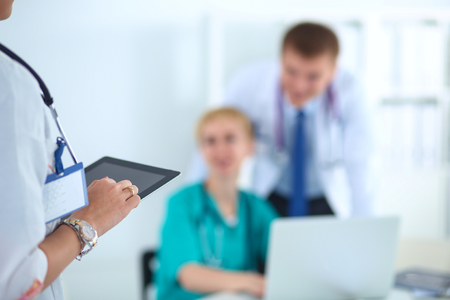 Woman doctor standing with stethoscope at hospital .の写真素材