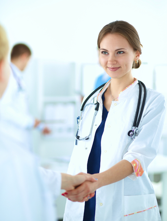 Young medical people handshaking at office .の写真素材
