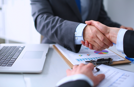 Business handshake. Business people shaking hands, finishing up a meetingの写真素材