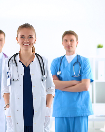 Attractive female doctor in front of medical group .の写真素材