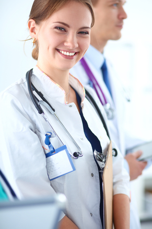 Woman doctor standing with stethoscope at hospital .の写真素材